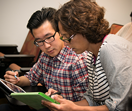 a teacher helps a student read