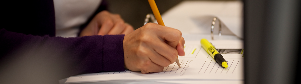 a student writes a paper in class