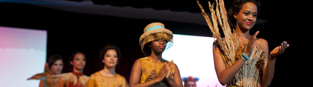 Students pose and walk a runway