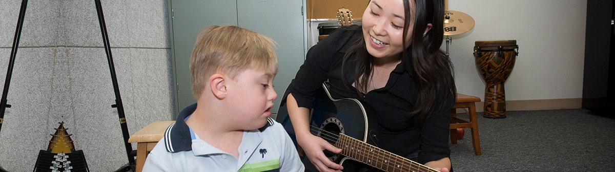 students record music inside of a studio
