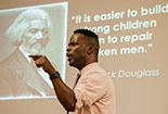 A professional talking about his presentation to a classroom
