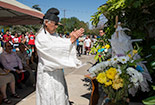 A religious follower walking at an event outside