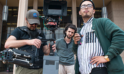 Students in front of Oviatt Library with a Camera rig.