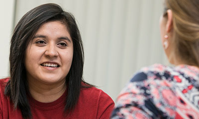 Student looking at advisor.