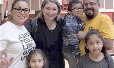 Family smiling at camera.