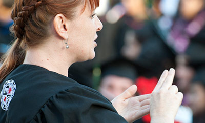 A individual performing American Sign Language.