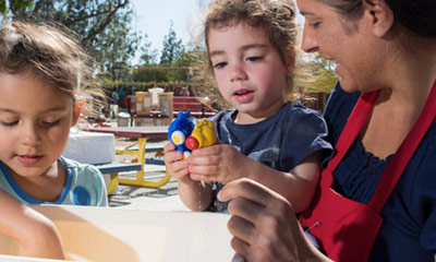An adult talking to a child.