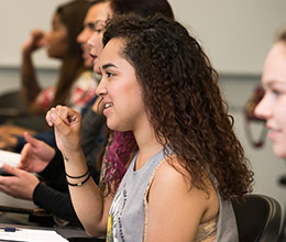 a woman signs in American Sign Language