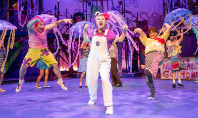 Students performing on stage.